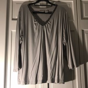 Chico’s 3/4 sleeve top with heading at neckline.